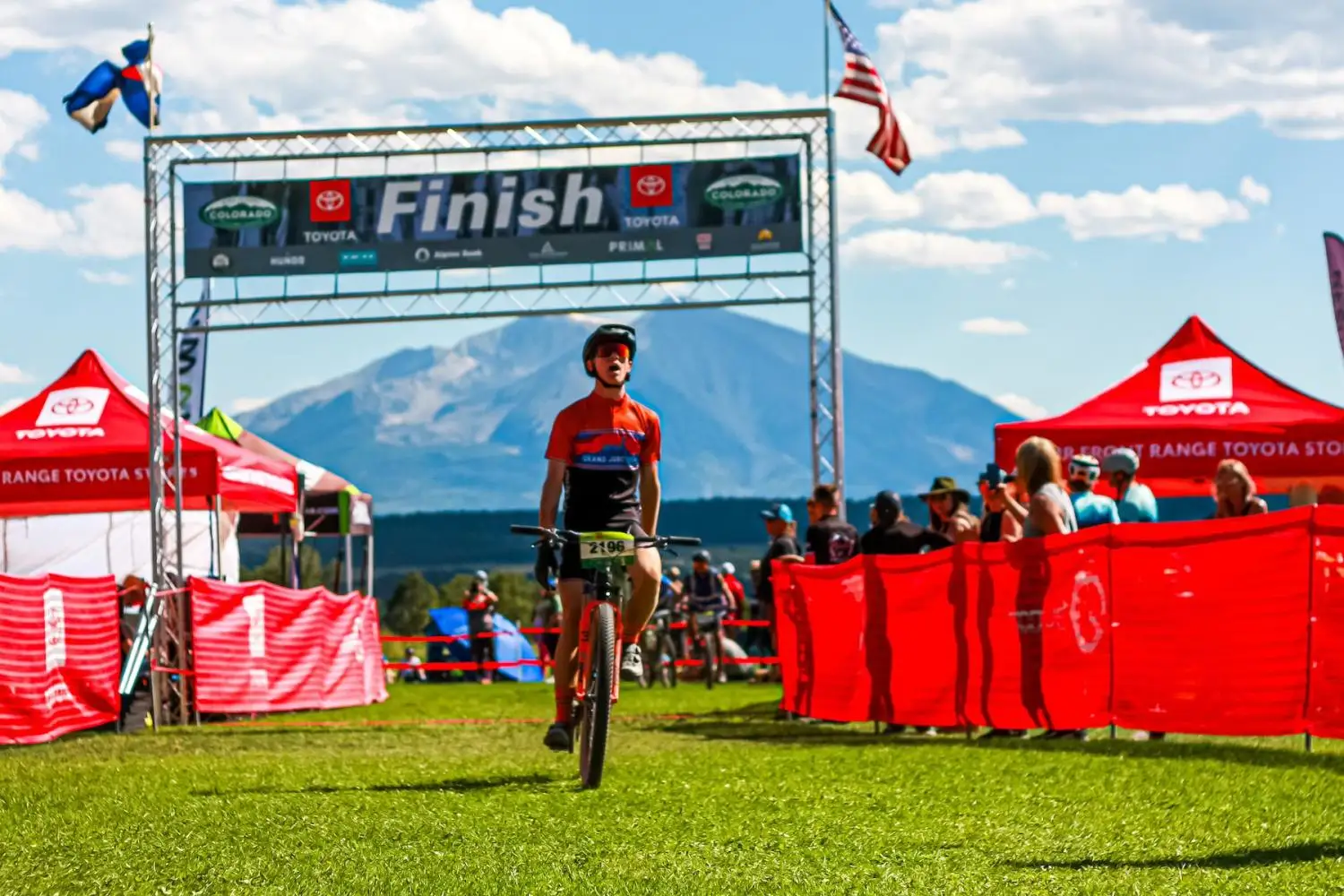 Photo of a mountain bike racer crossing the finish line